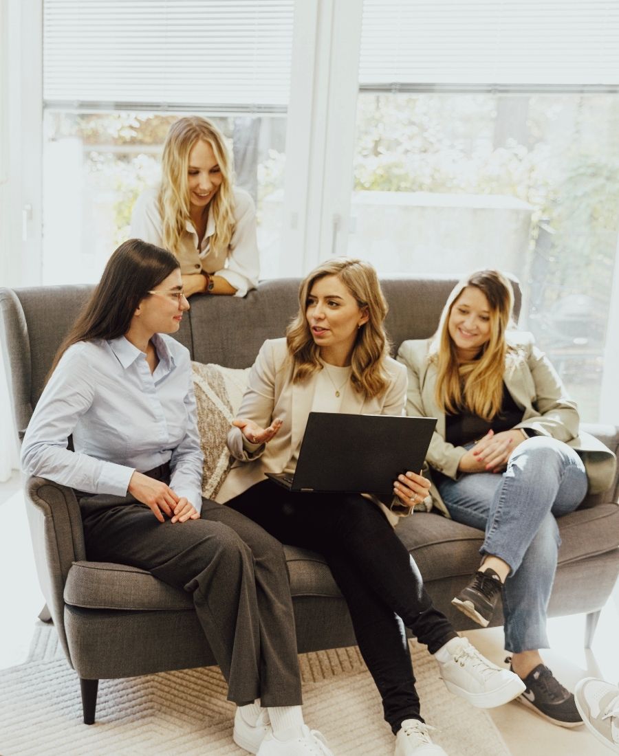 foxdot Employees Sitting on a Couch and Talking