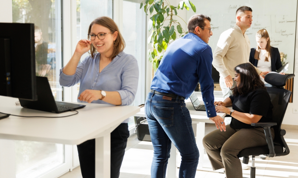 Woman and man shaking hands at a meeting