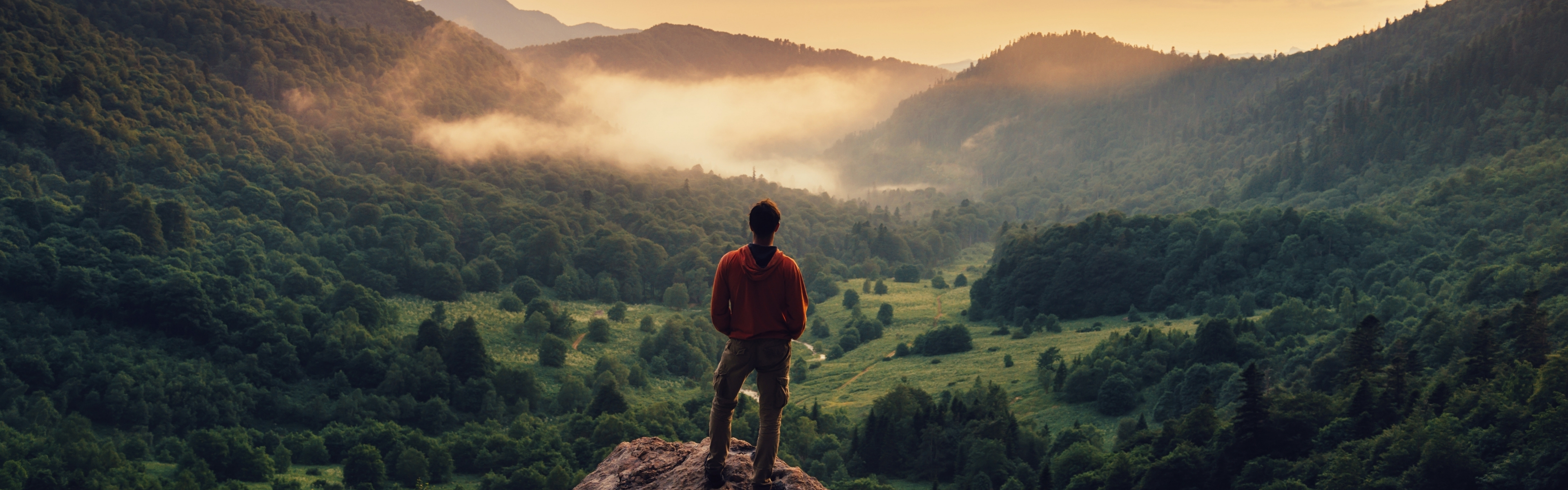 man standing on a mountain