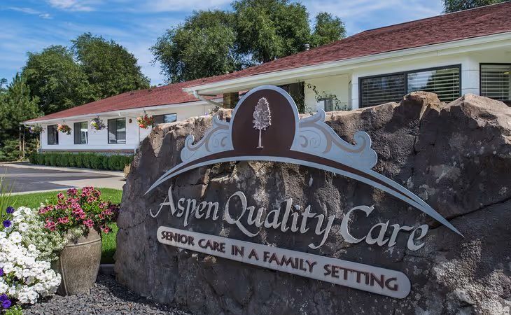 aspen quality care exterior sign on rock