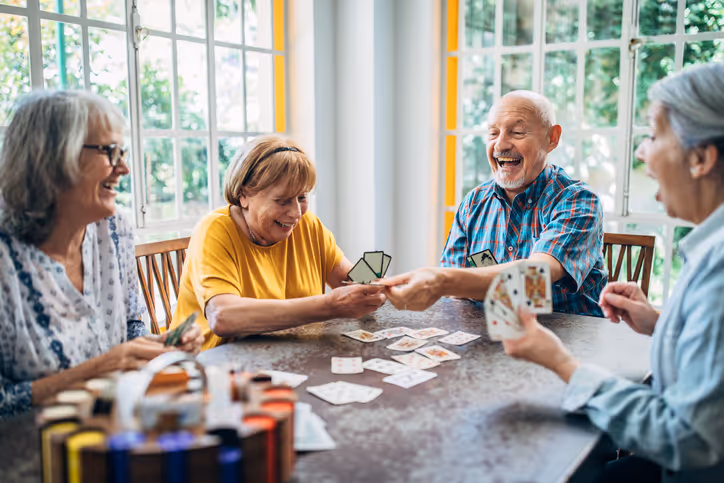 seniors playing cards at a table