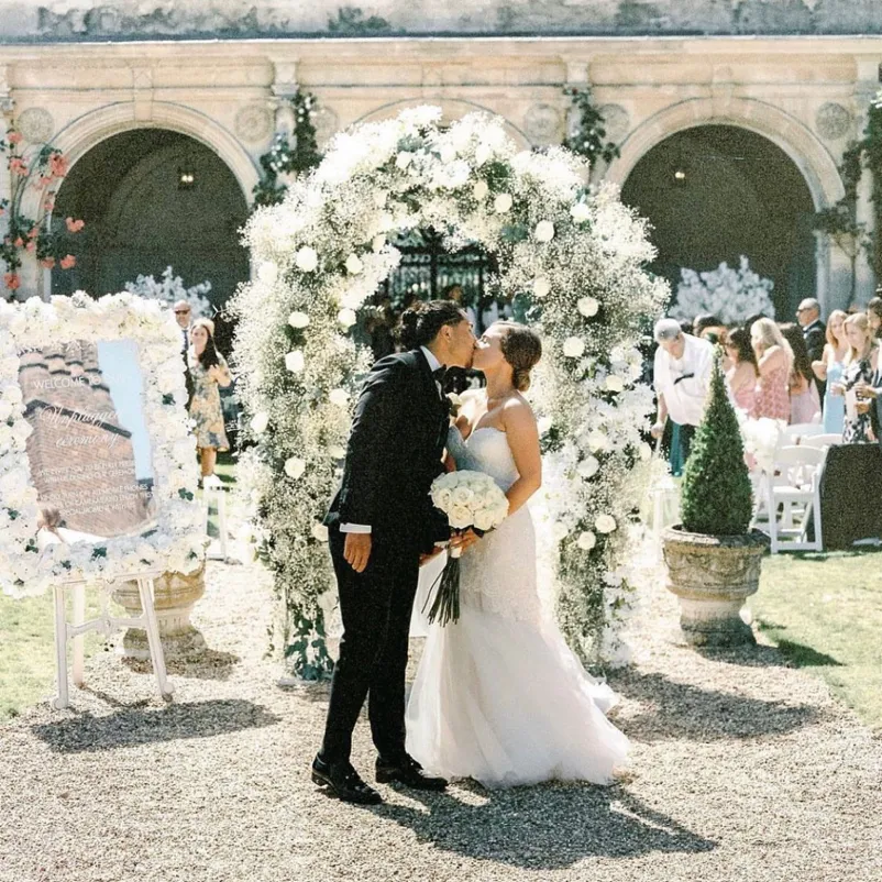 Blissful bride and groom lock eyes.the bride and groom share a tender moment, framed by the enchanting Loggia setting.