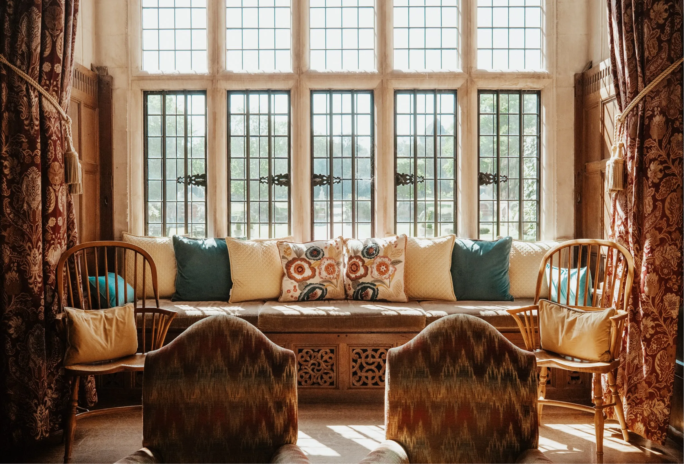 Historical luxurious interior room in North Mymms Park mansion house, featuring floor-to-ceiling window