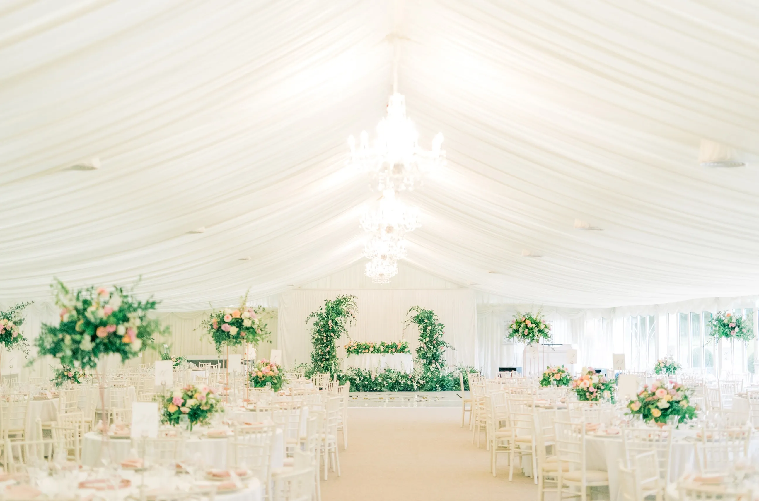 Enchanting wedding reception at North Mymms Park's pavilion, adorned with beautiful flowers