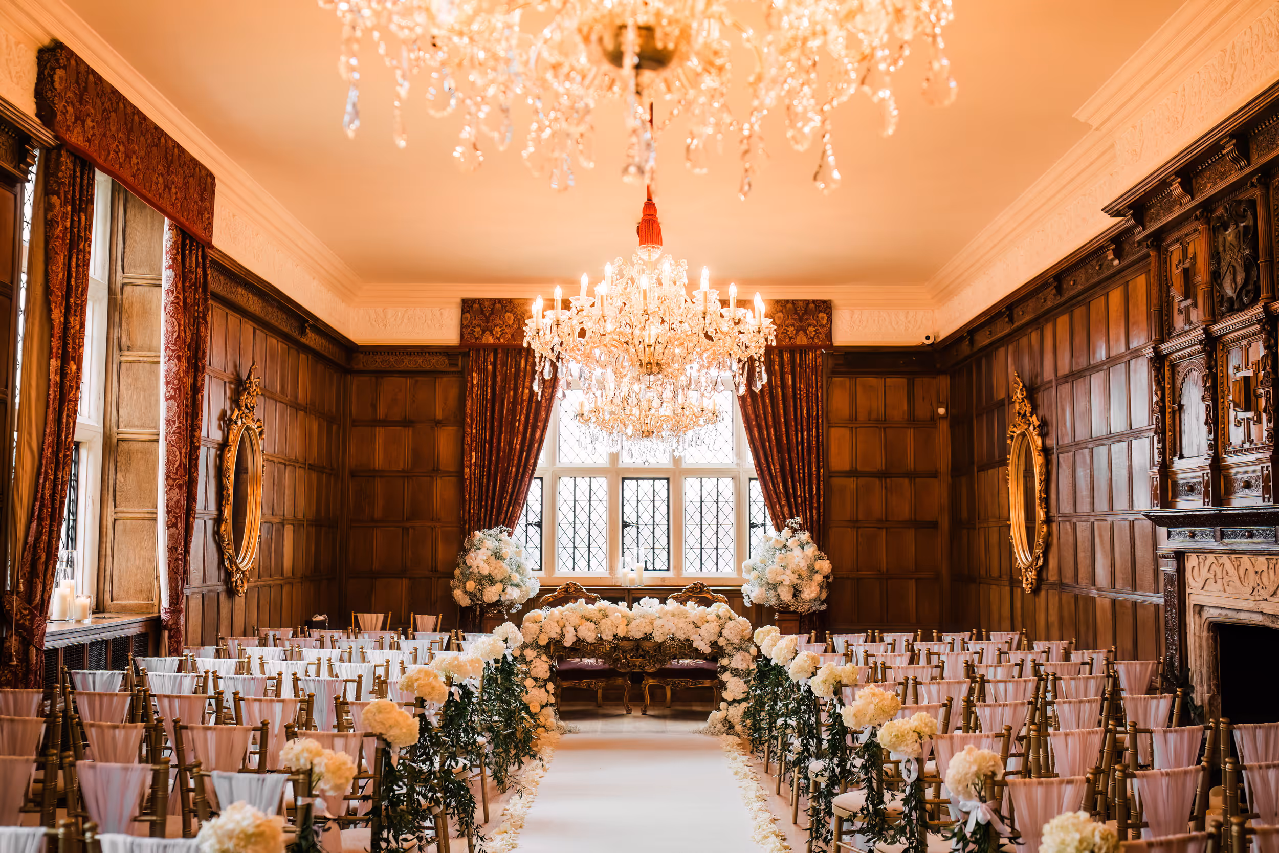 Beautiful floral setup for a civil ceremony in the Jacobean Room at North Mymms Park, featuring oak paneling—a perfect choice for intimate weddings.