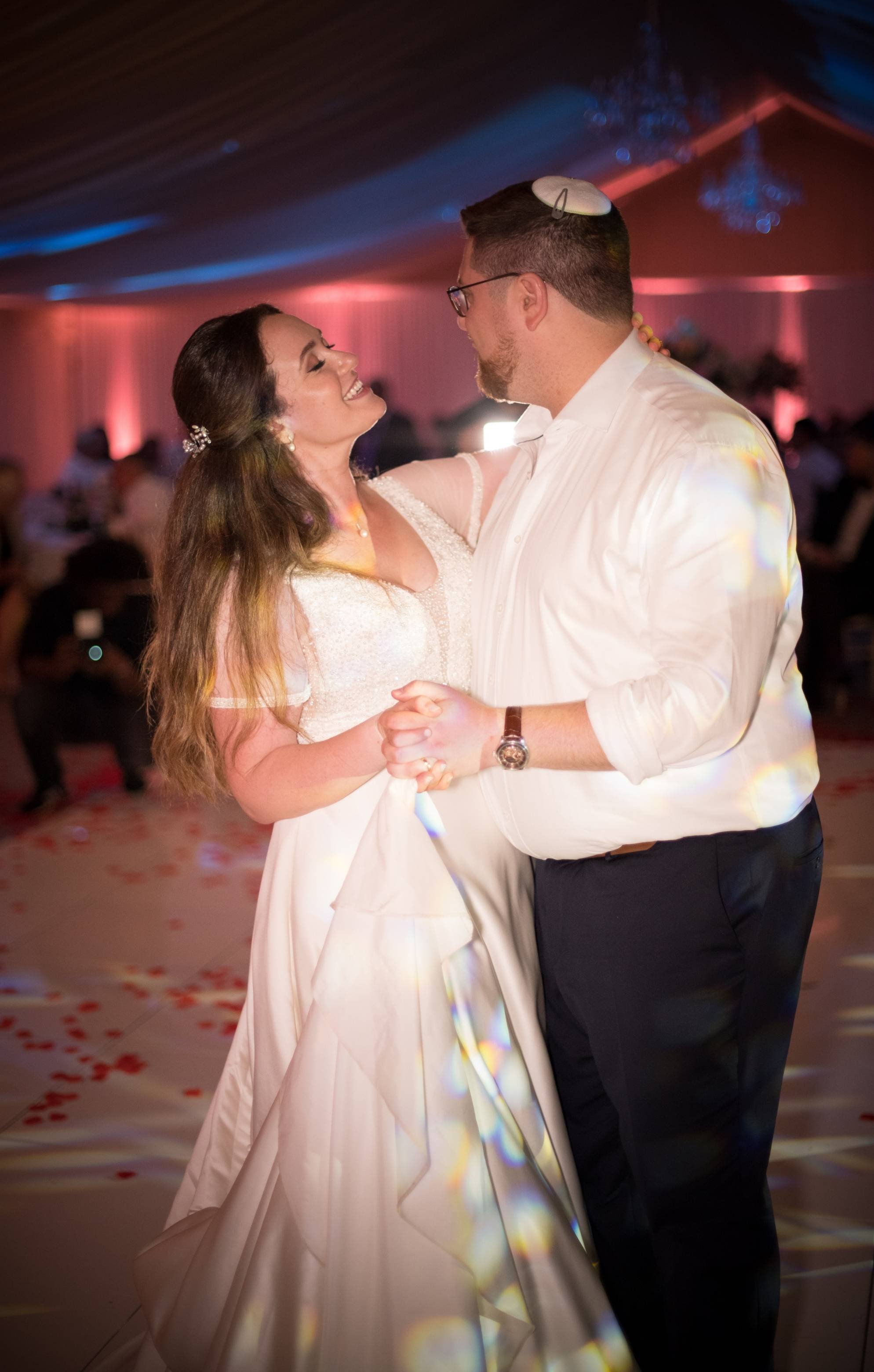A Jewish bride and groom sharing a first dance together on the dance floor inside the Pavilion marquee at North Mymms Park.