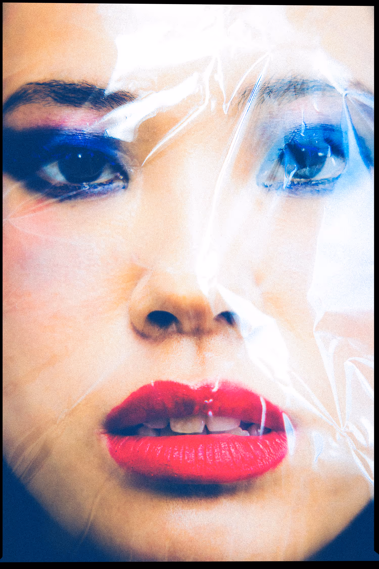 Woman’s face wrapped in plastic