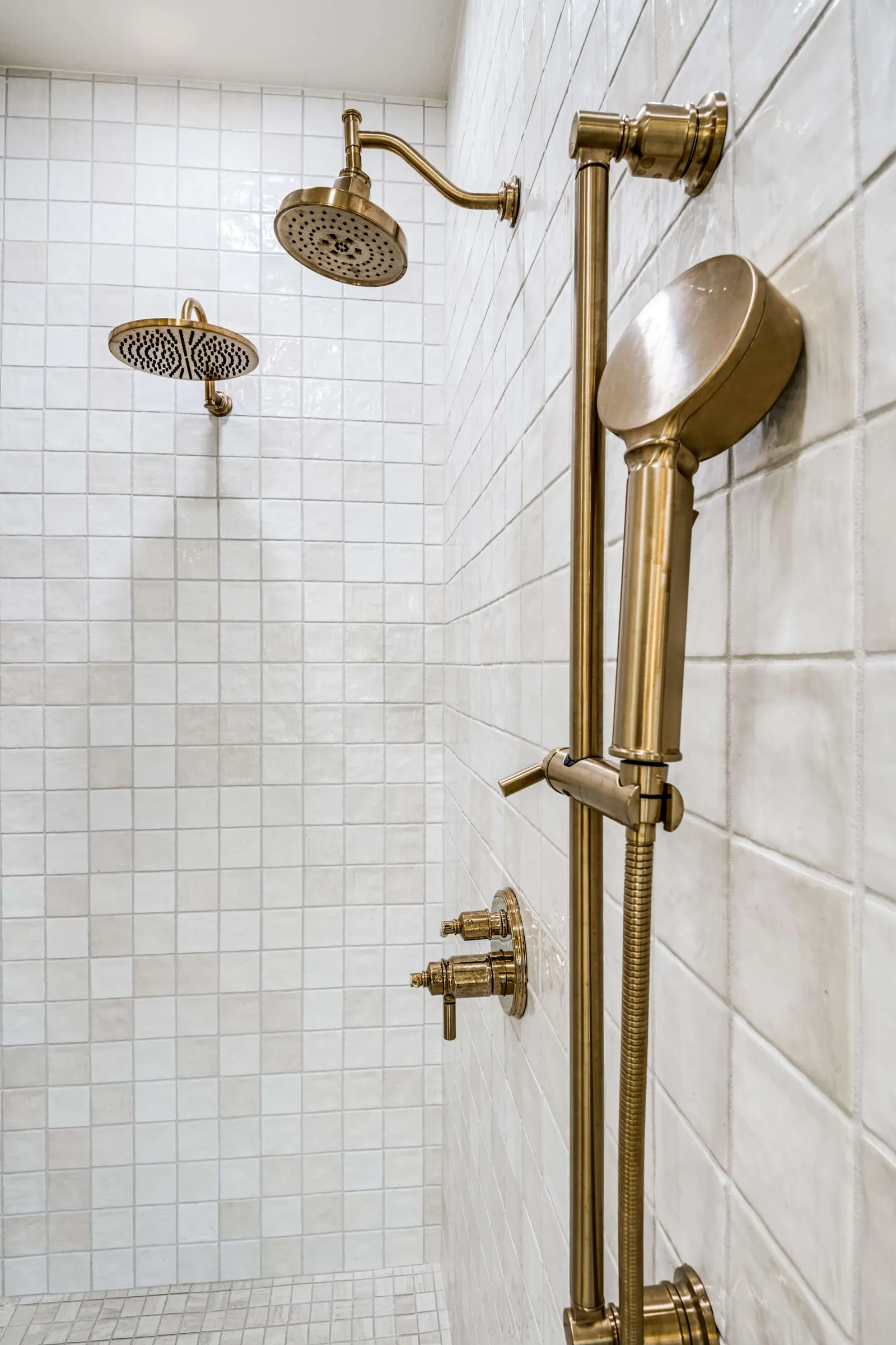 Luxury shower remodel white and gold