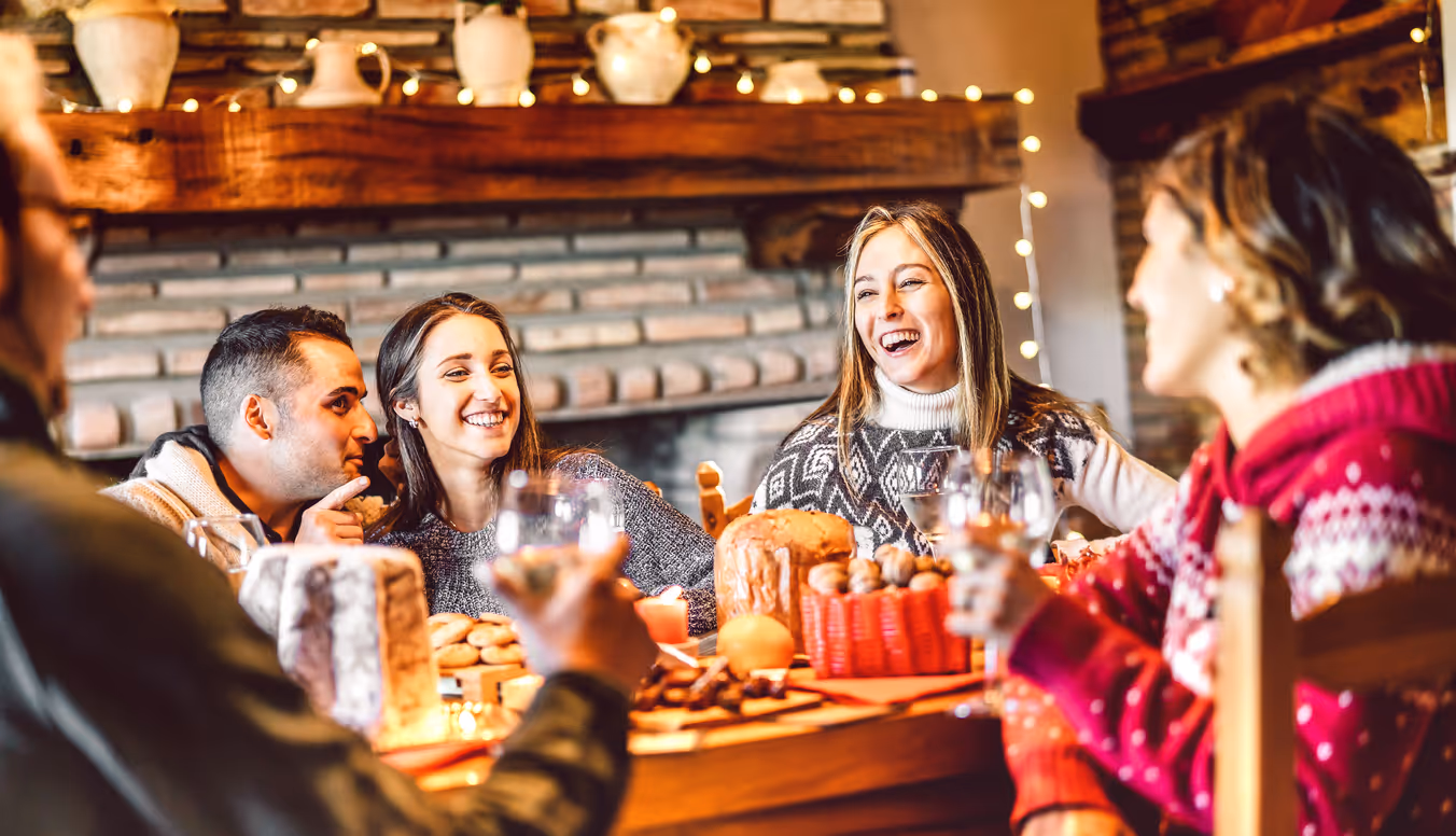 Family gathering around holiday table