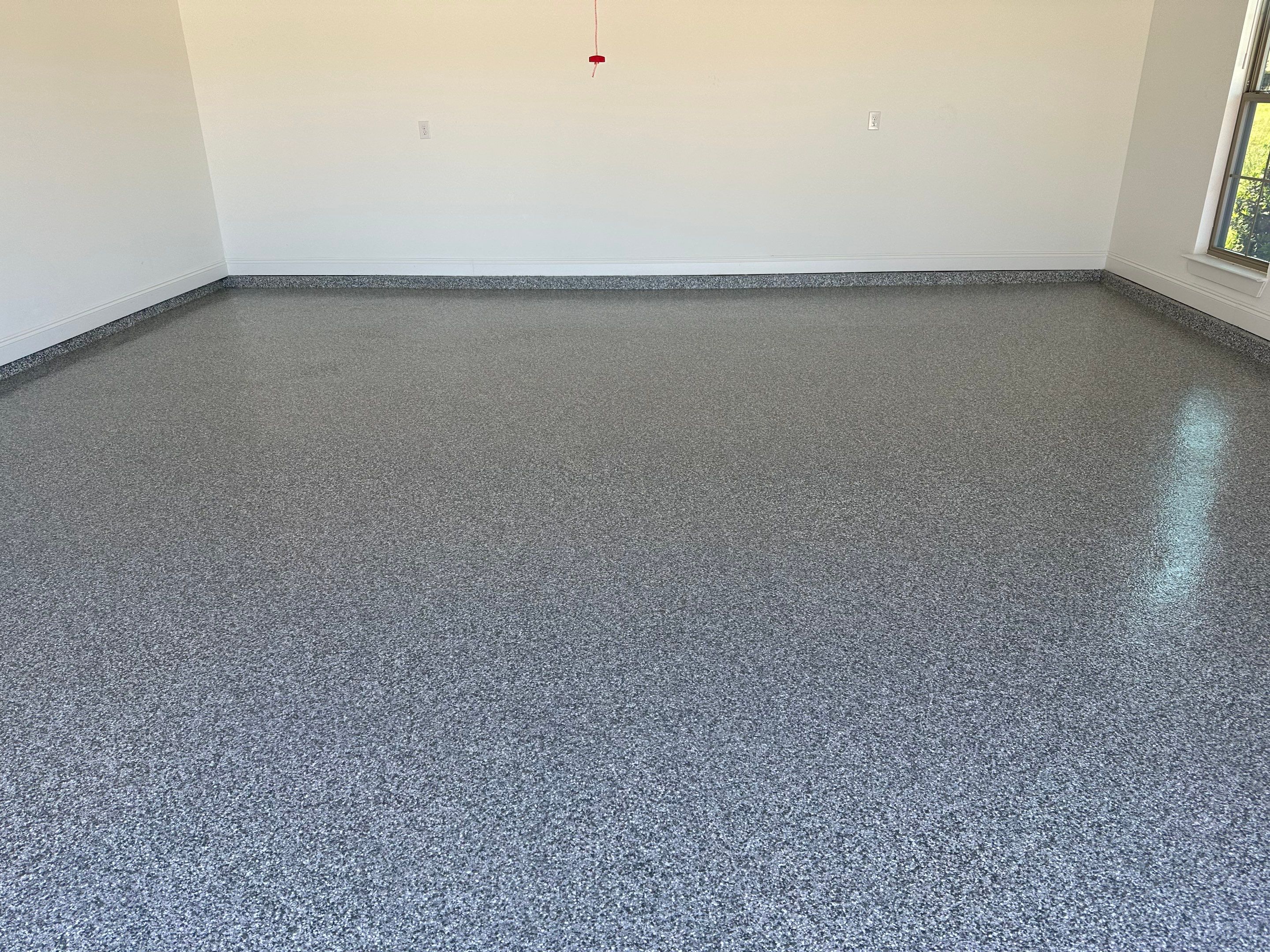 Garage Floor Coating Installed by Cornerstone Hard Surface Restoration in Gulf Shores, AL