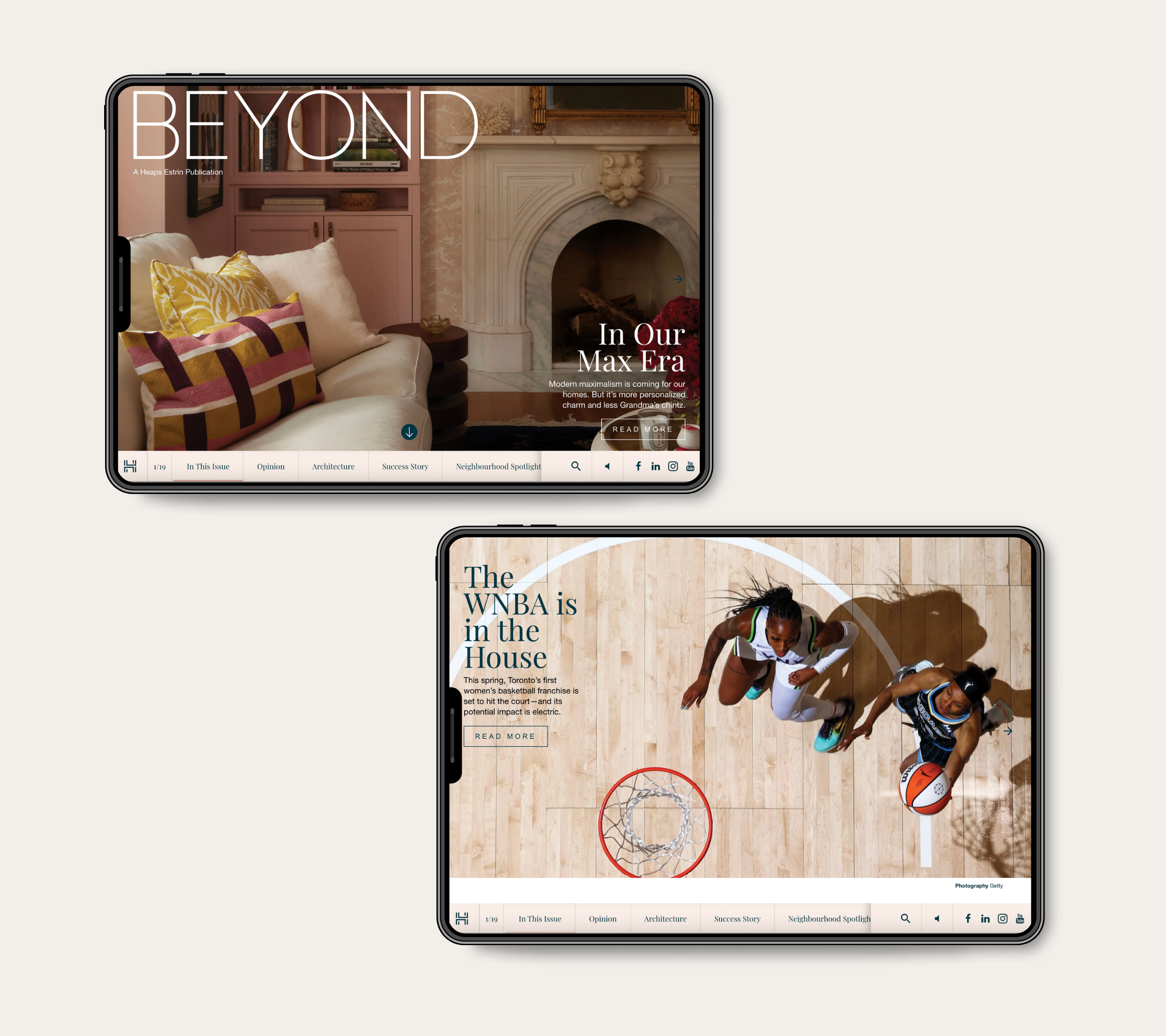 Two digital tablets arranged vertically on a light background displaying the online version of BEYOND magazine. The top tablet shows a article titled "In Our Max Era," featuring an elegant living room interior with a cream sofa, patterned pillows, and a large fireplace. The bottom tablet displays an article titled "The WNBA is in the House," featuring an overhead view of two female basketball players on a court near the basketball hoop.