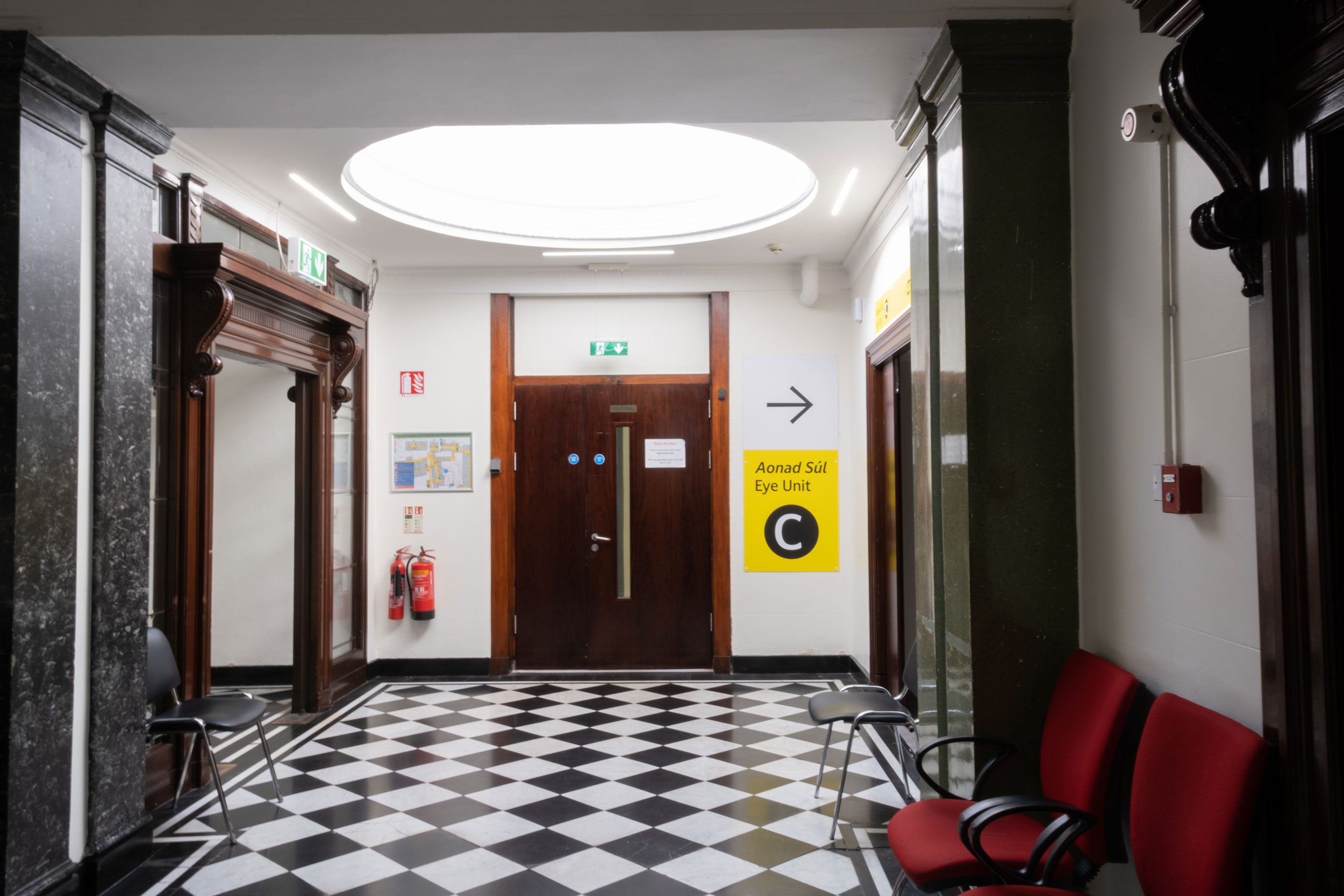Entrance to Eye Unit C, featuring large accessible yellow sign.