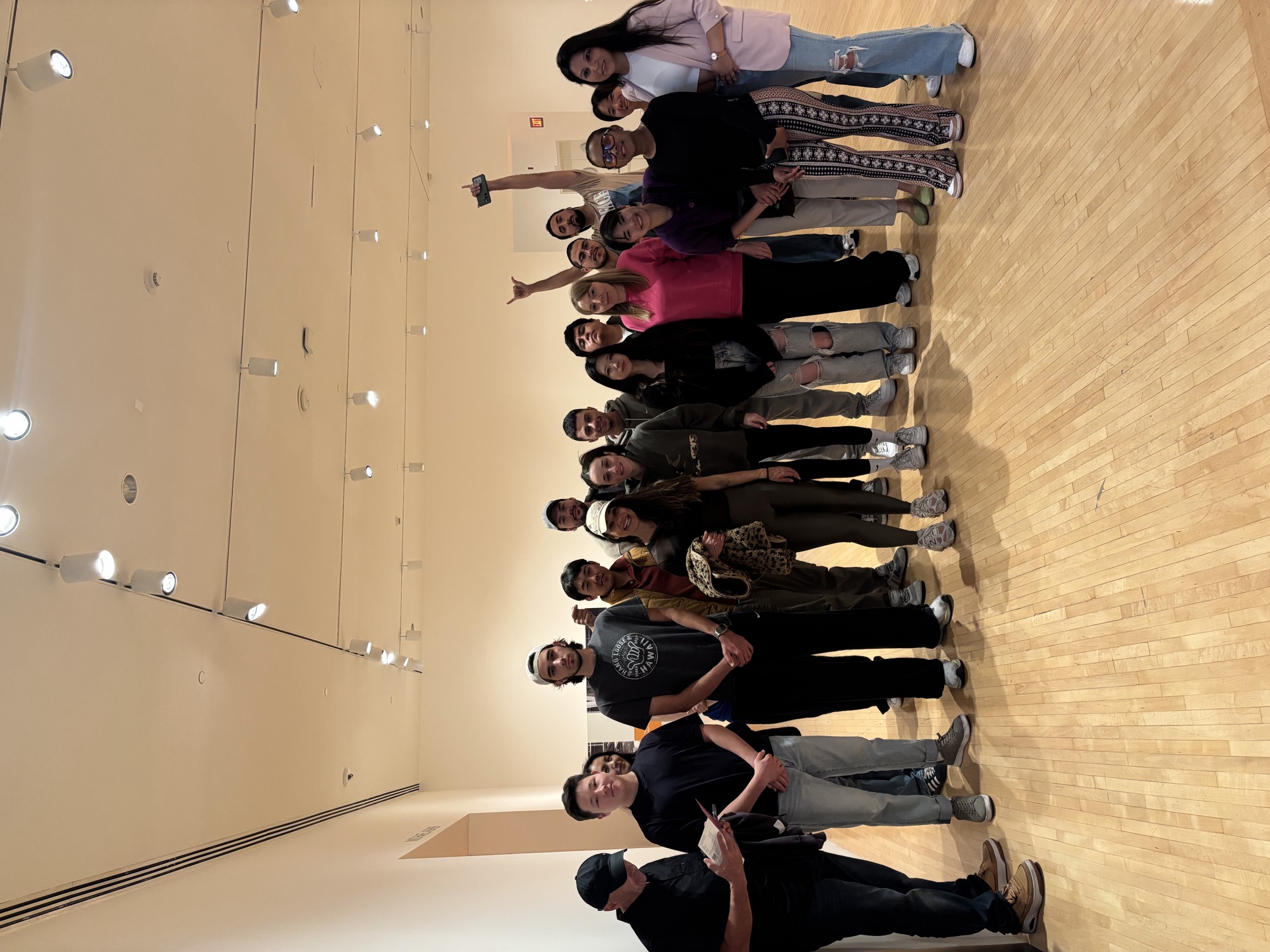 CWC students posing together in a MOCA museum gallery on a Columbia West College cultural outing