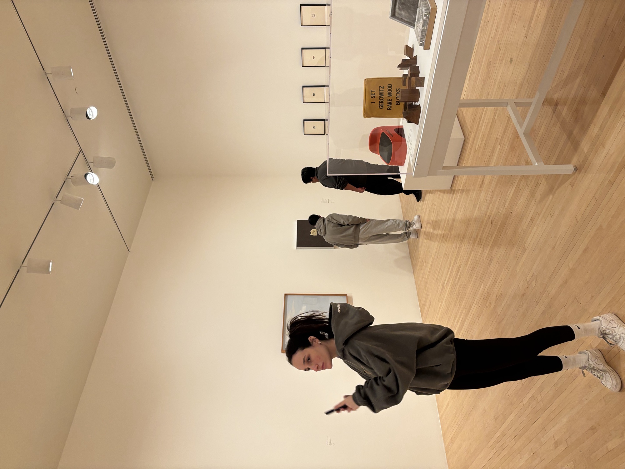 Columbia West College students viewing a historic wood block display at MOCA, tracing the evolution of language and expression across centuries