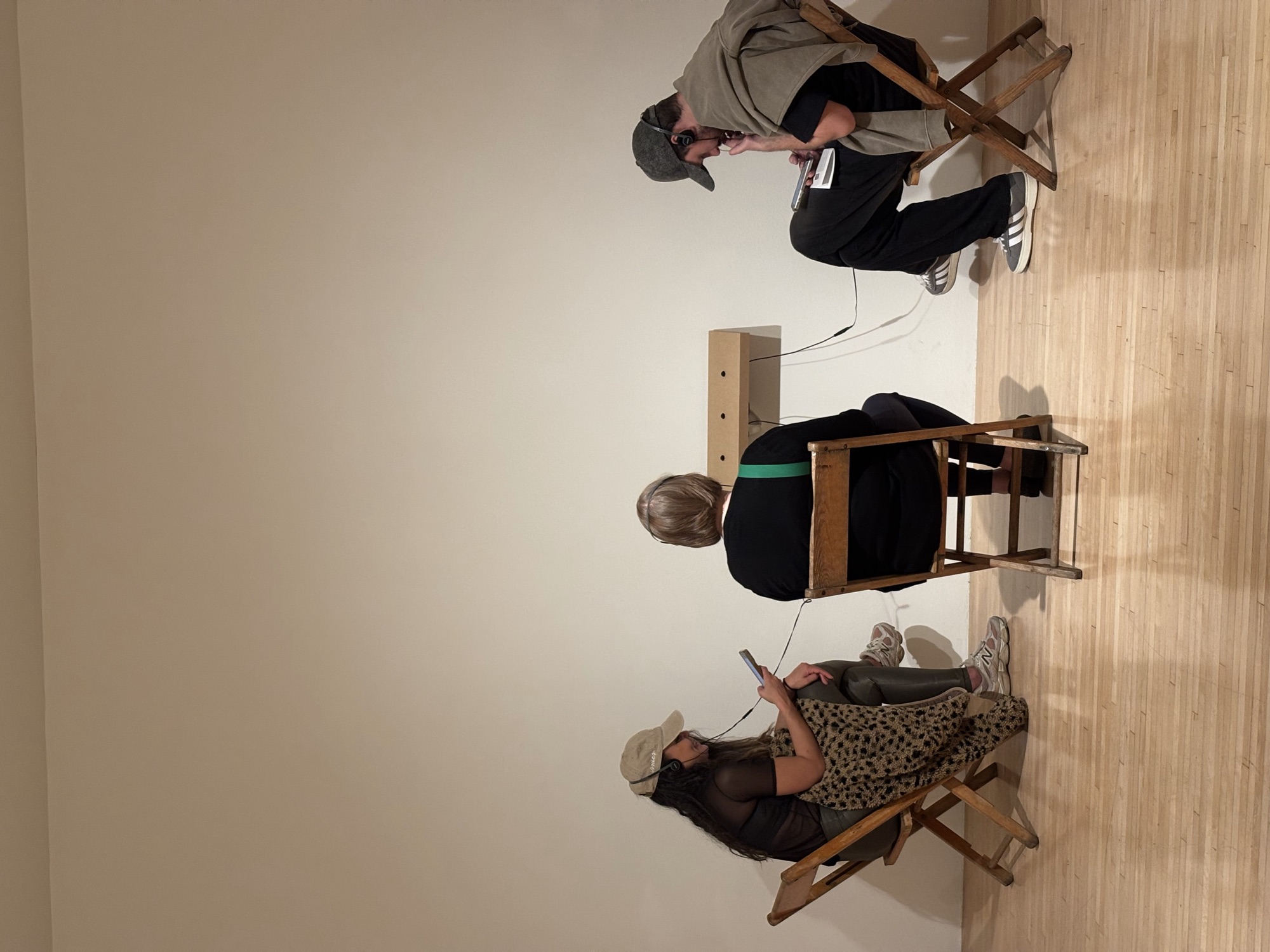 Audio chairs listening exhibit at MOCA visited by CWC students, illustrating the importance of tuning your ear to British slang