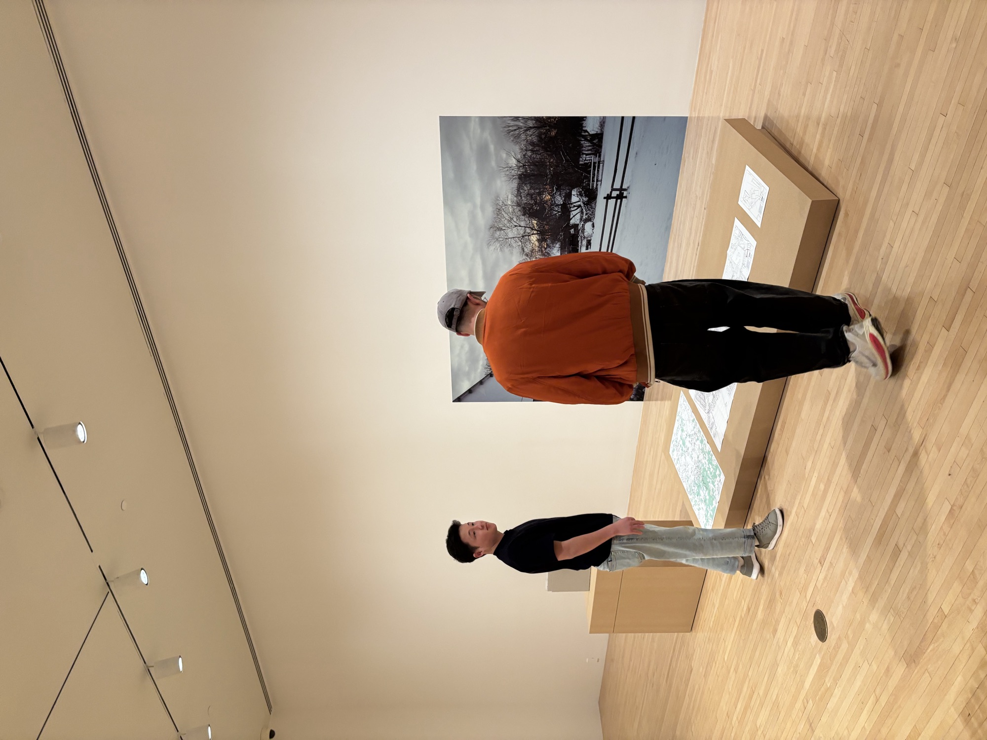 Two CWC students discussing an artwork at MOCA, putting their English conversation practice to use on a cultural field trip