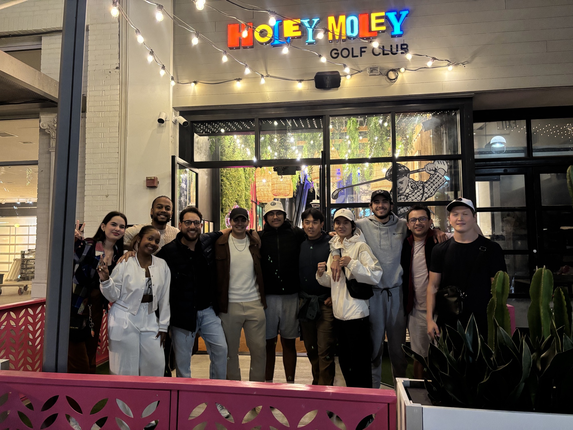 Full Columbia West College group photo outside the mini golf venue, celebrating English conversation practice and community outside the classroom