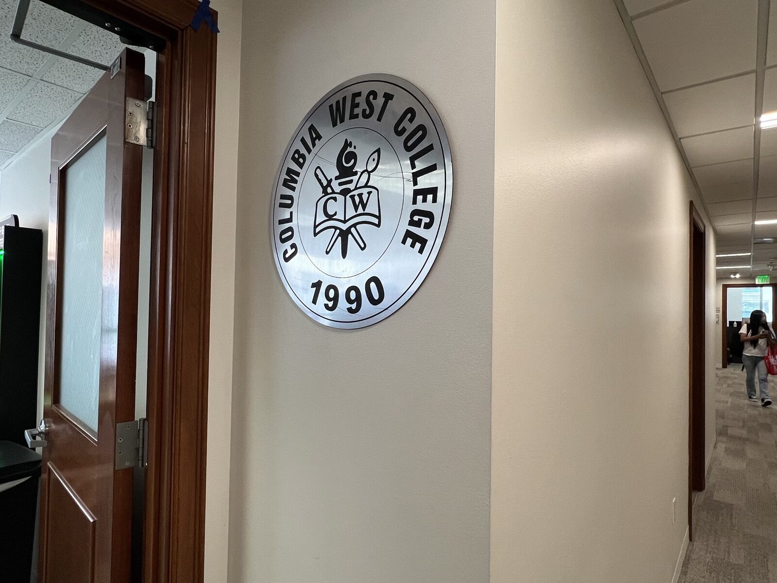 A classroom entrance and CWC logo in the hallway of the new Los Angeles campus
