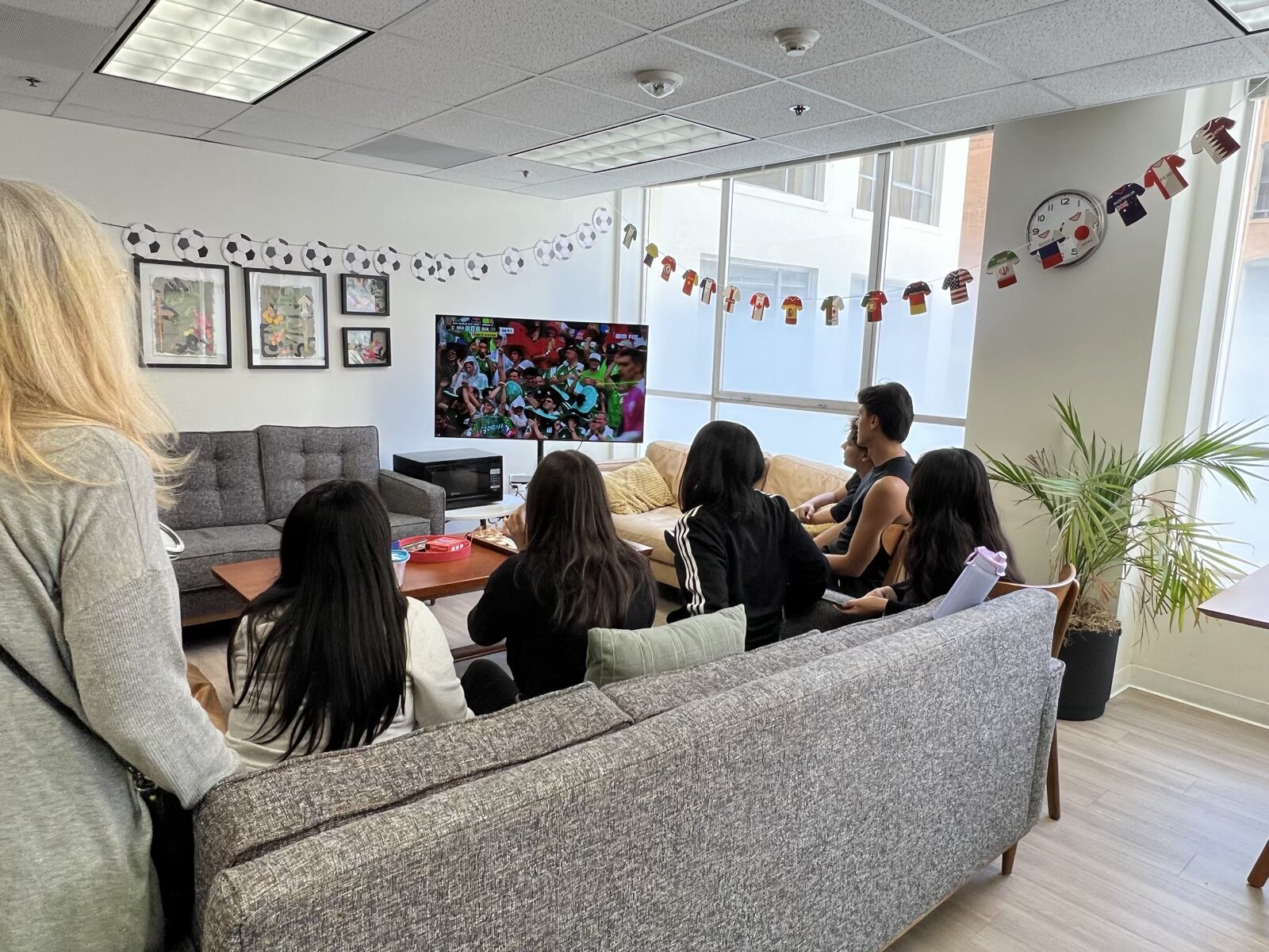 CWC students in the campus lounge discussing what has already happened during a shared activity