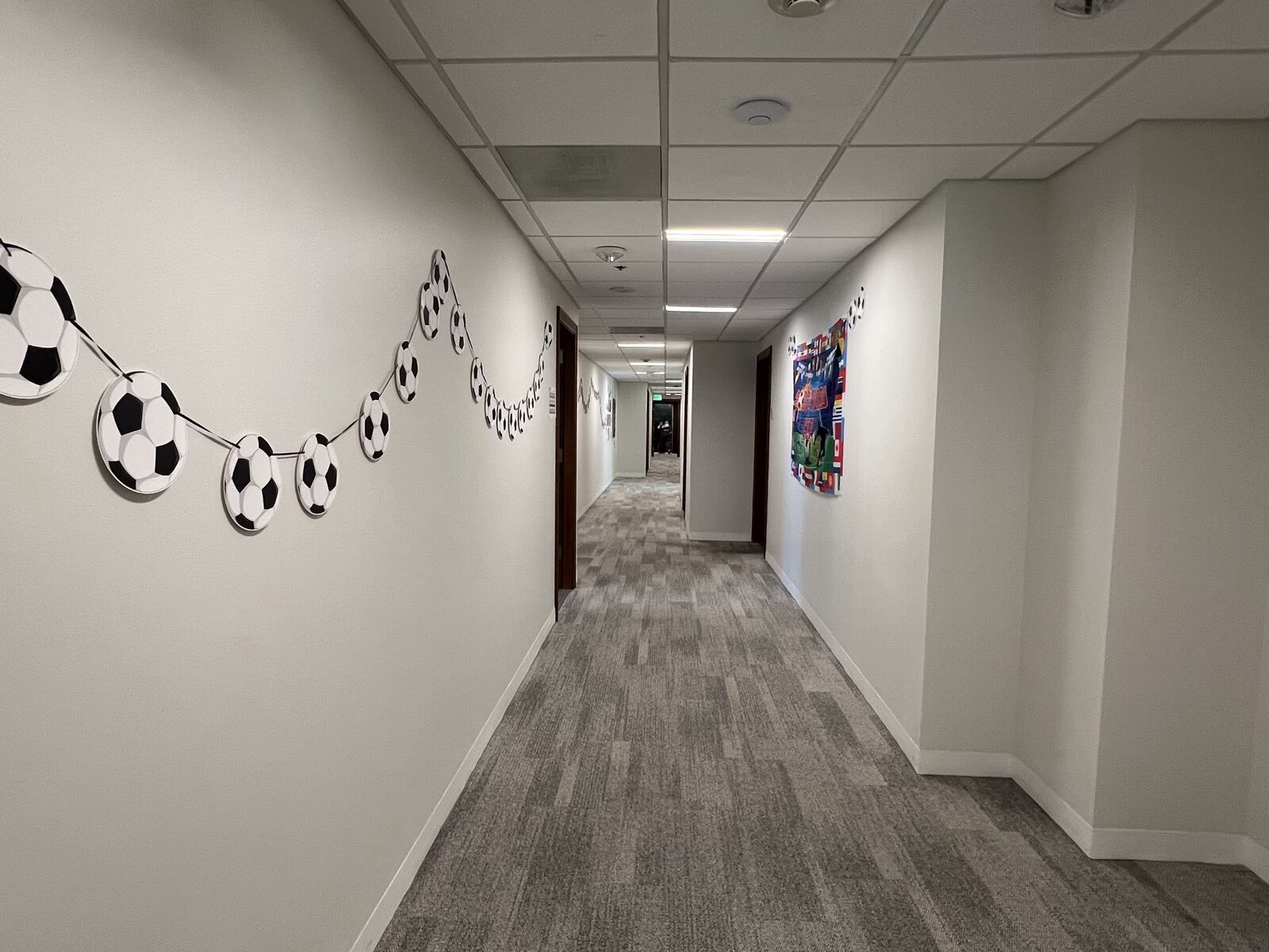 A decorated CWC campus hallway where learners can notice how small details change a message