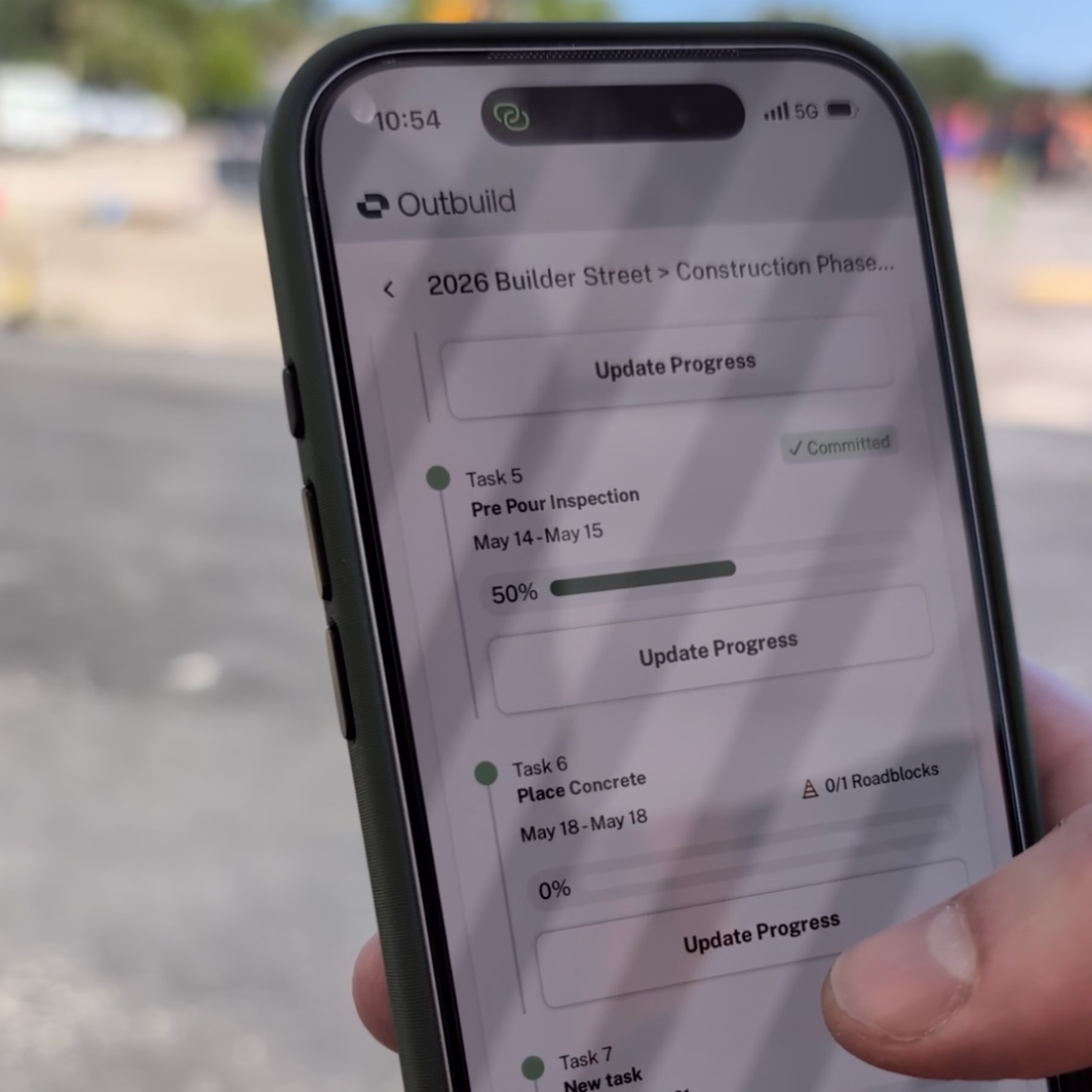 Smartphone screen showing a construction app with tasks and progress updates for Pre Pour Inspection and Place Concrete.