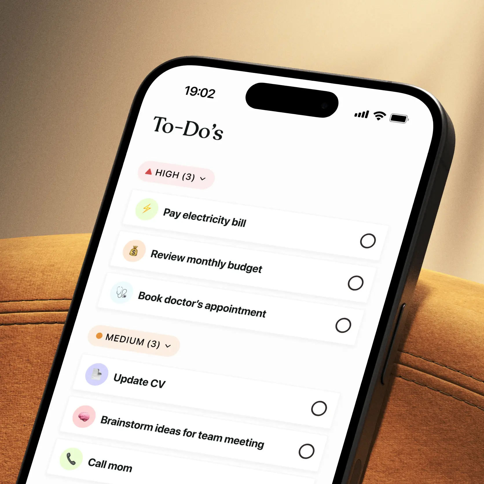 Smartphone displaying a Tiimo to-do list with tasks sorted into high and medium priority by AI, ready to check off.
