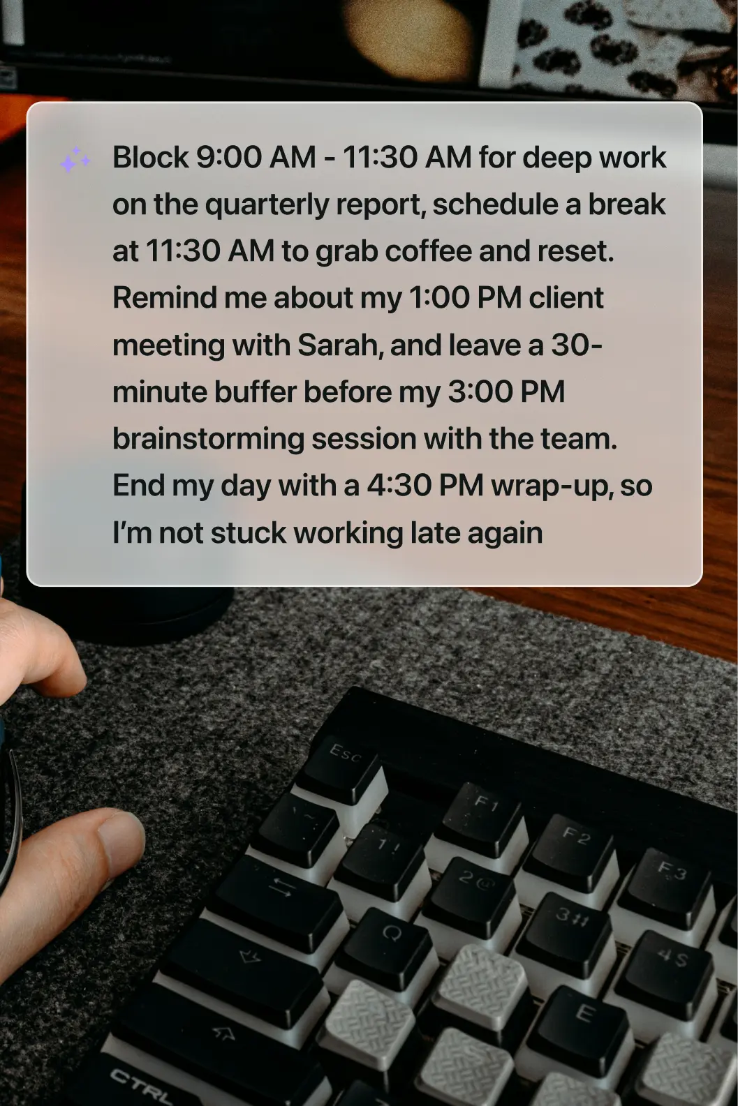 A desk with a keyboard and a digital overlay detailing a structured workday with deep work, meetings, and buffer time.