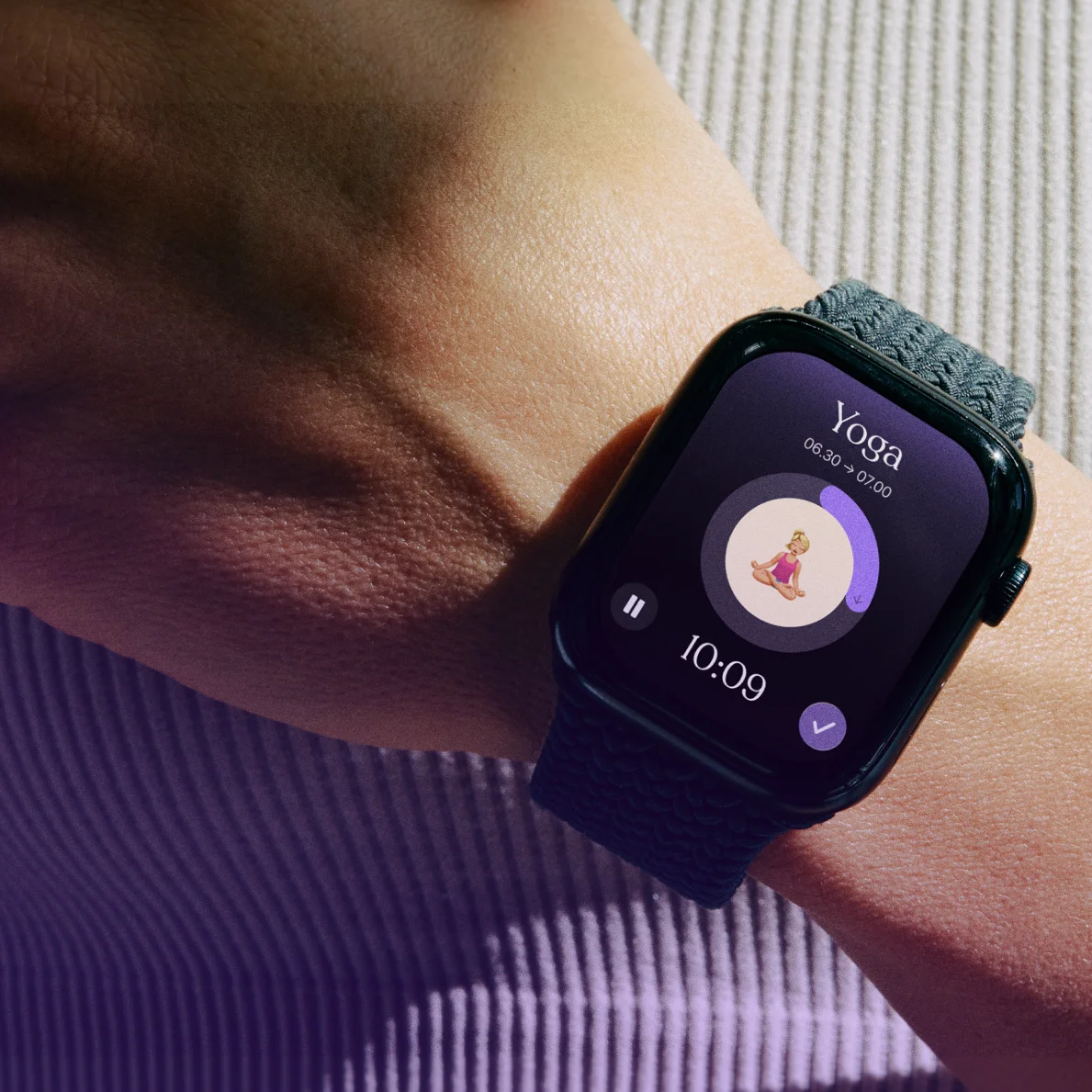 Apple Watch displaying Tiimo’s yoga focus timer with a visual progress ring, pause button, and complete button.