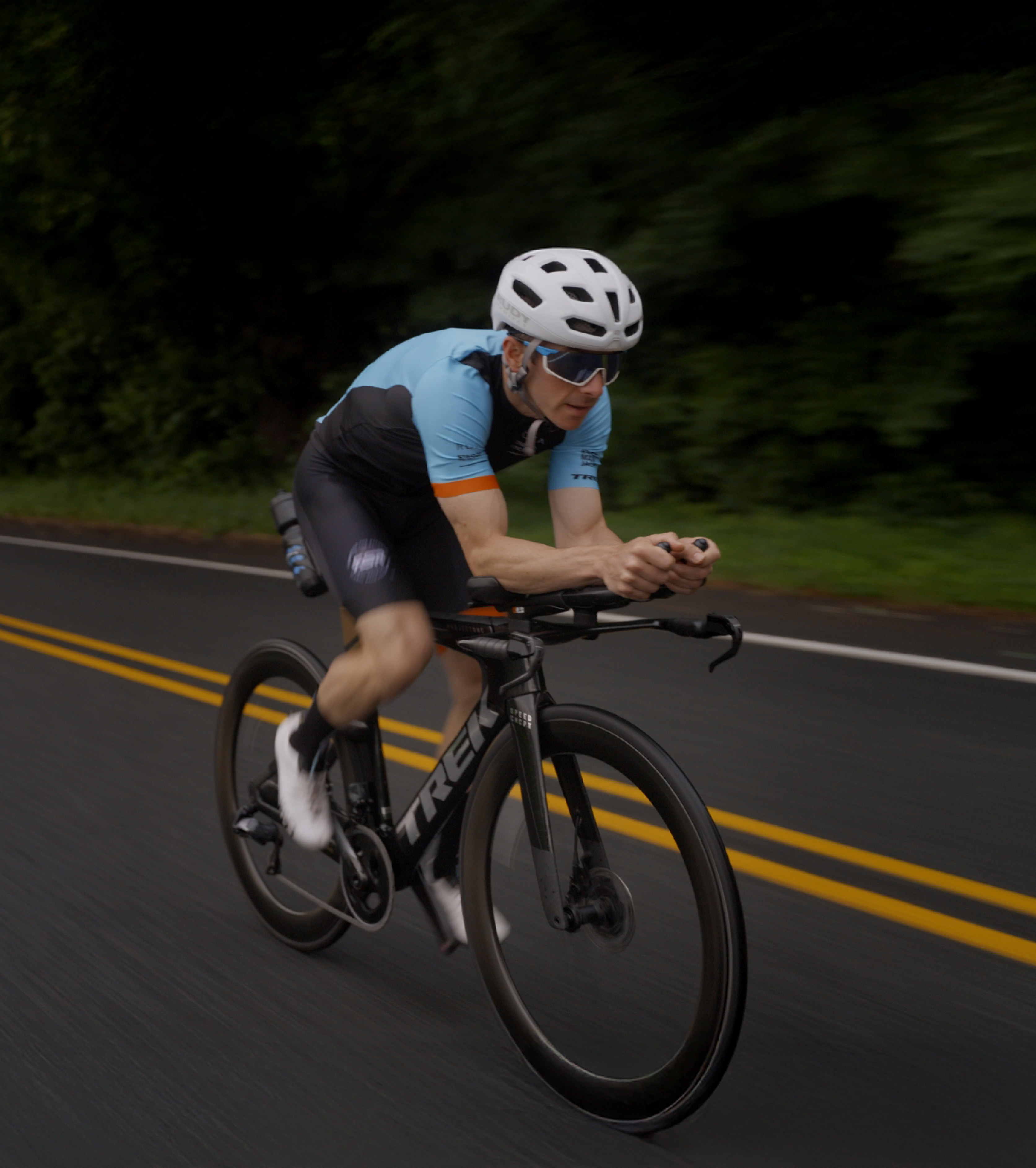 Professional cyclist riding a custom built bike from Biked