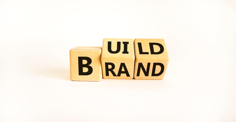 letter blocks spelling "build brand"