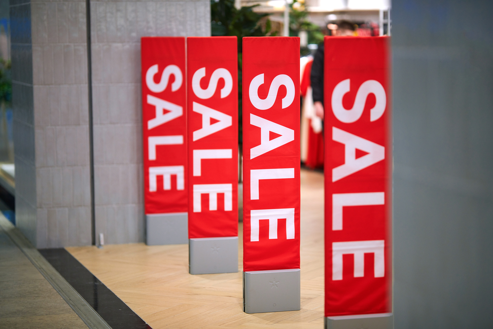 Red sale signs outside of outlet store