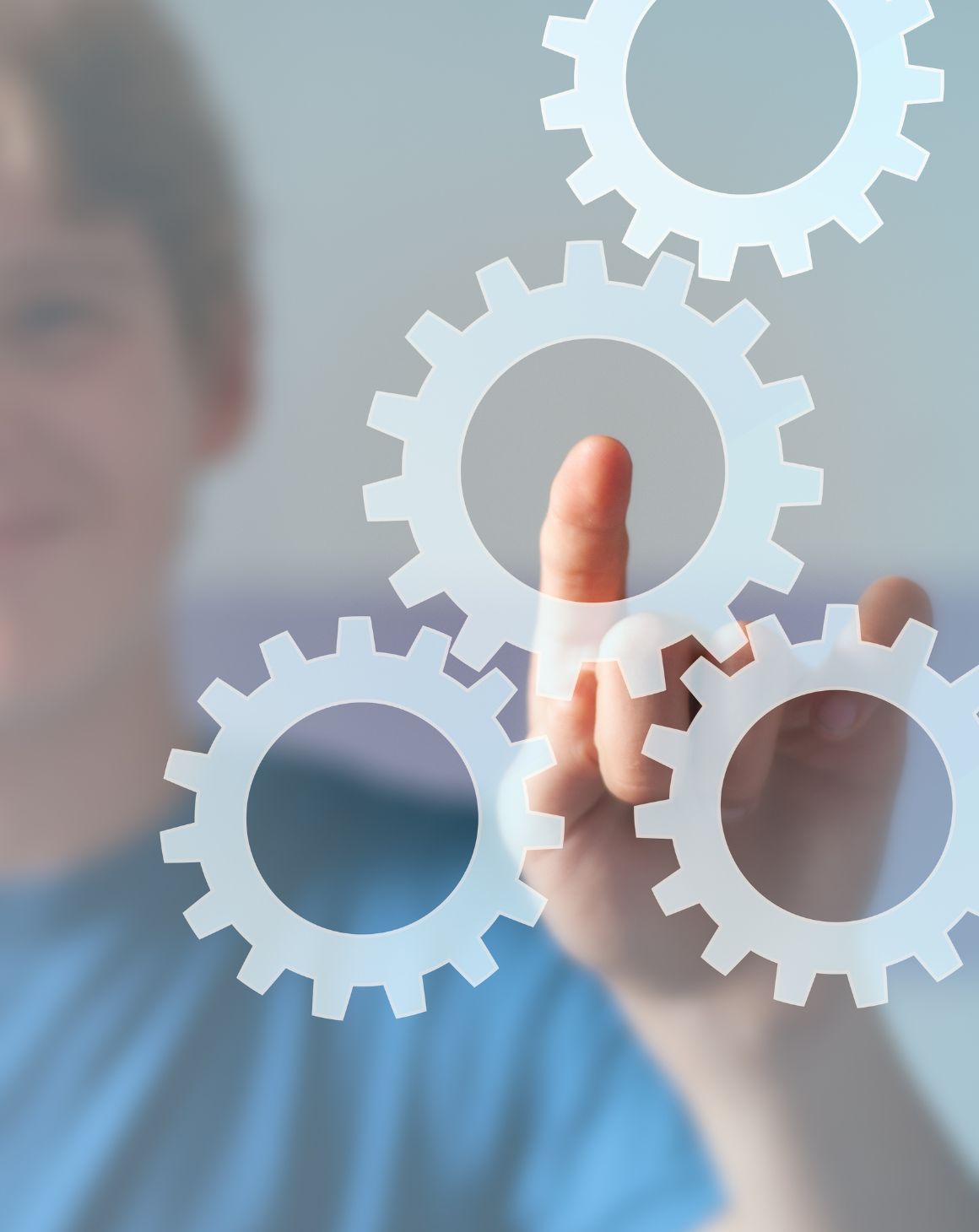 a man pointing to settings gear icons