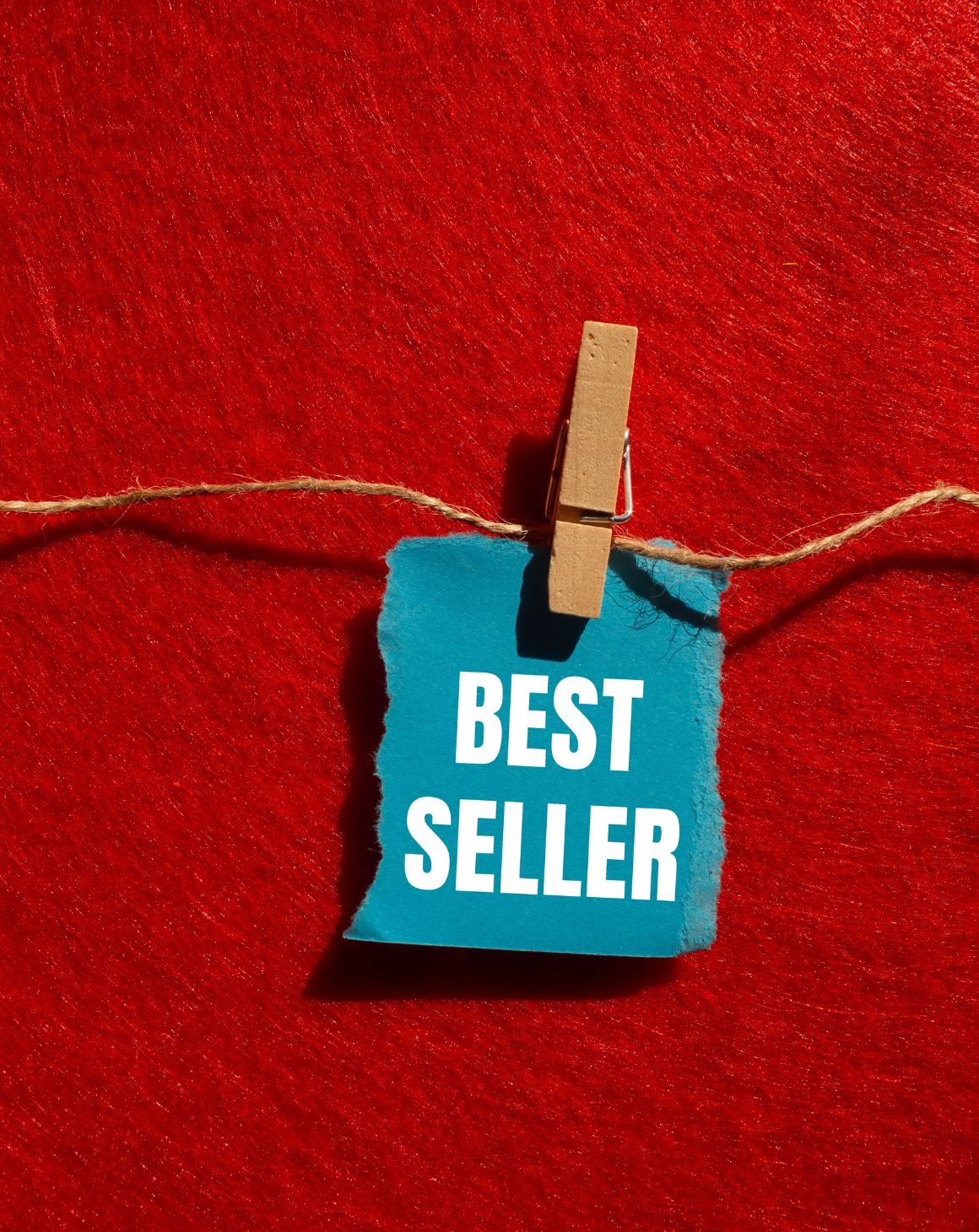 a clothing line with a piece of paper hanging that says "best seller"