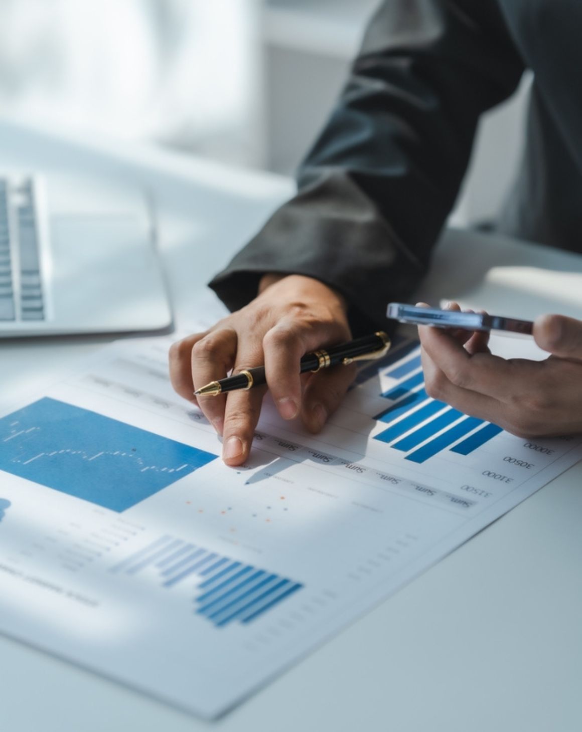 a person pointing to a graph