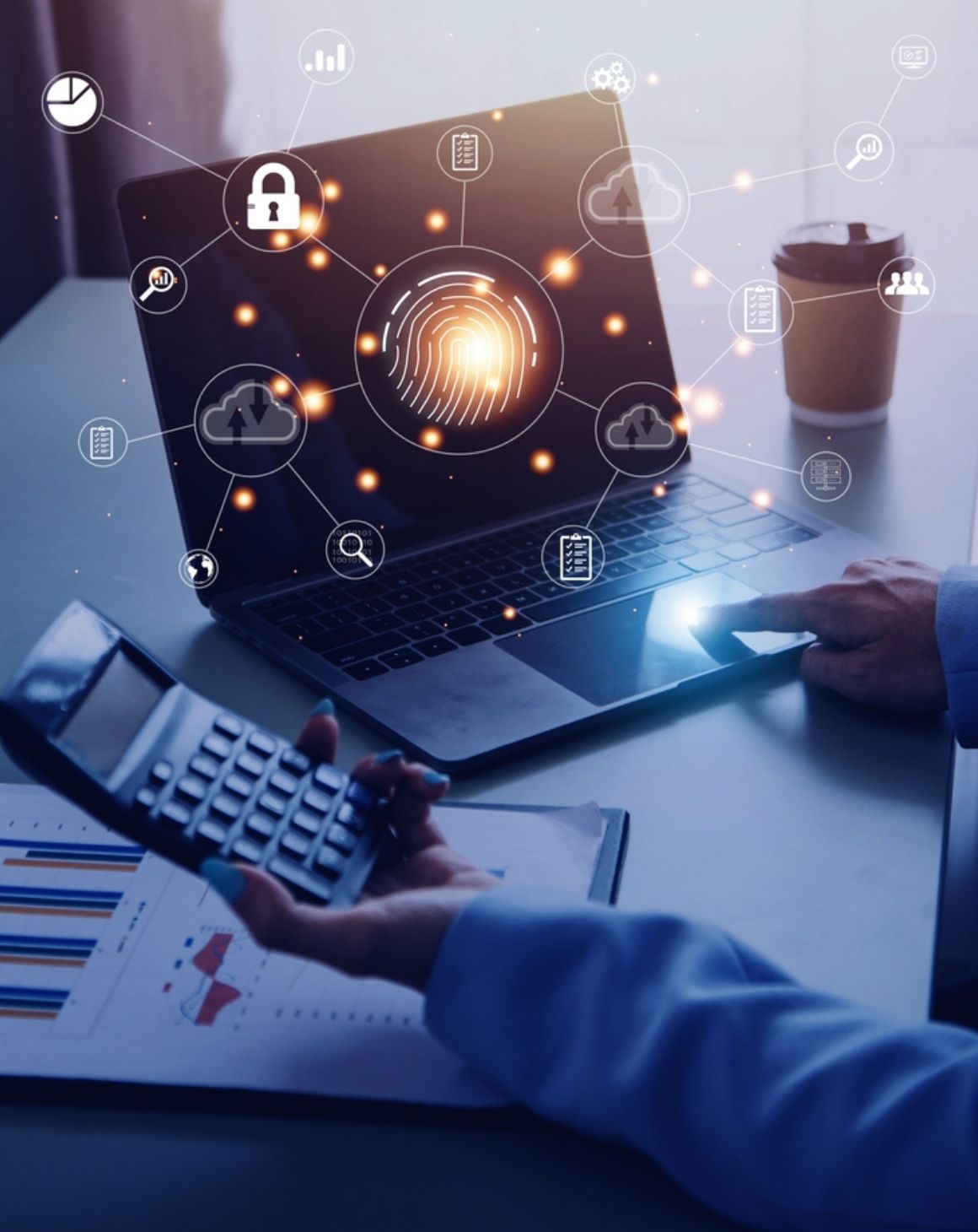 man working on a laptop displaying various digital icons on the screen
