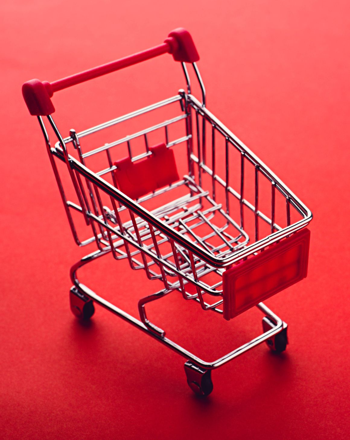 A shopping cart on a red background