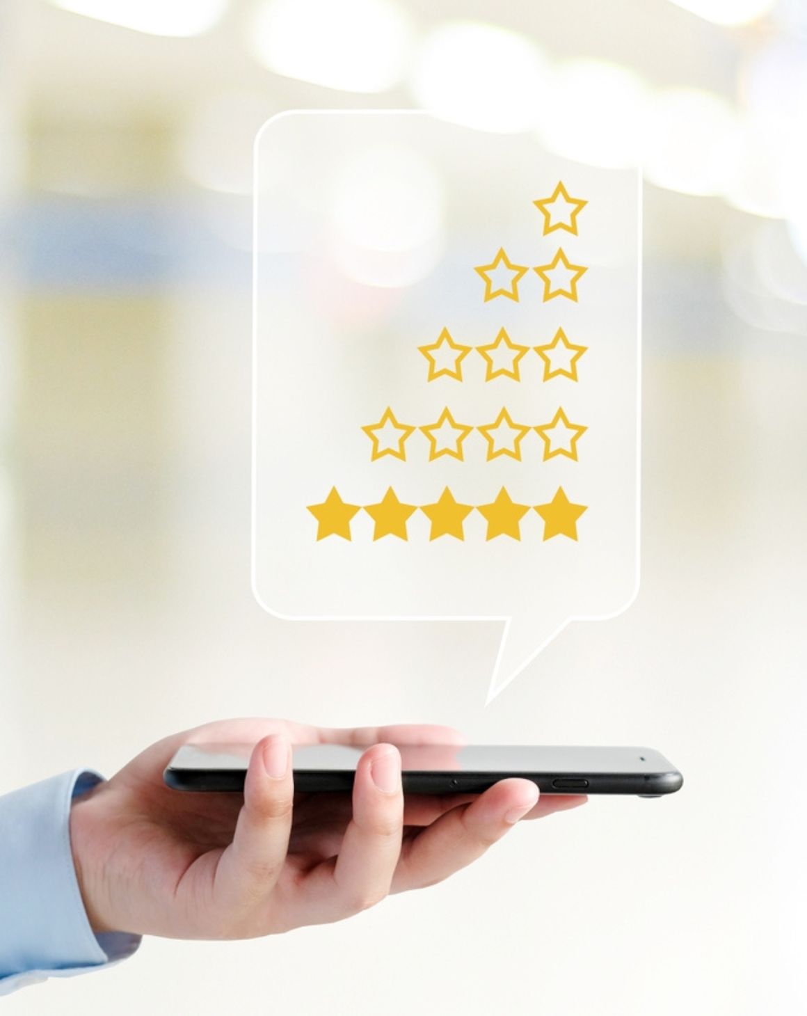 hand holding a mobile phone with review rating stars