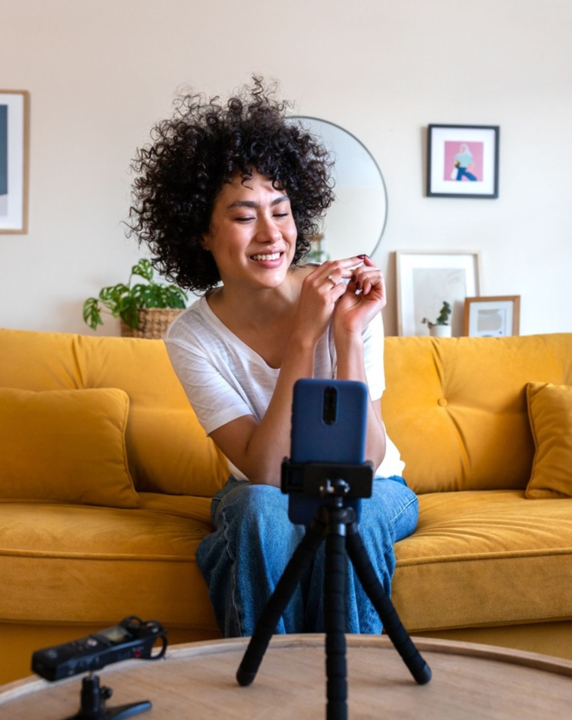 an influencer setting up a tripod with a phone for video recording