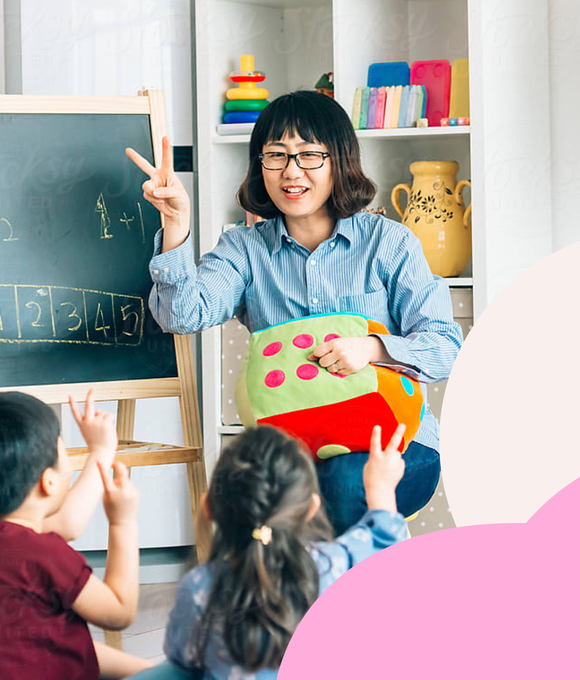 A woman teacher teaching a class of children