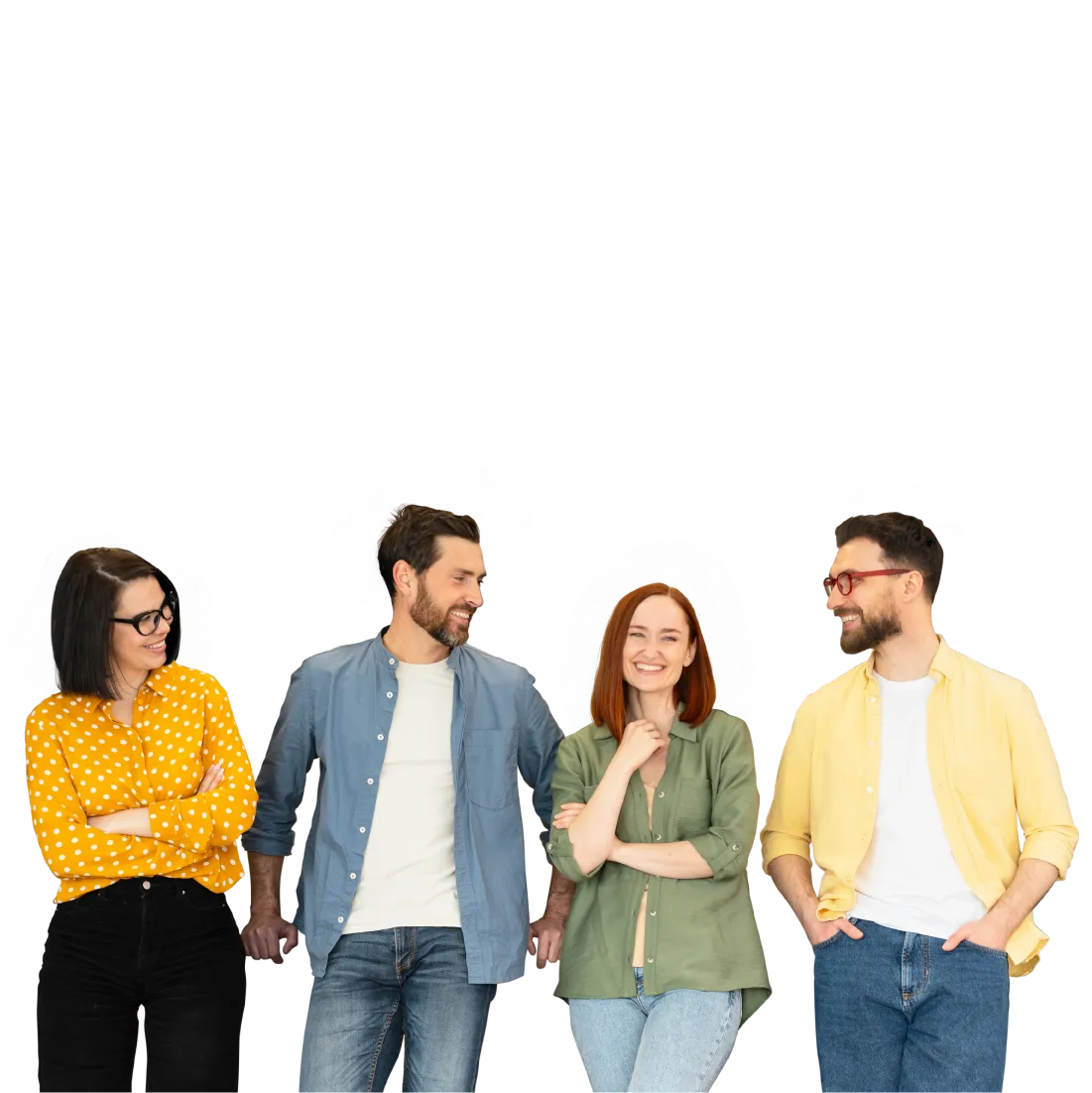 Group of four casually dressed people standing and smiling, engaged in conversation.