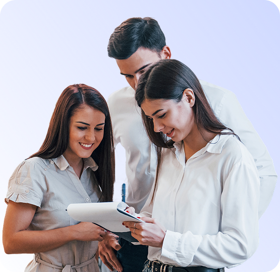 Three young professionals reviewing notes on a clipboard together against a light purple background.