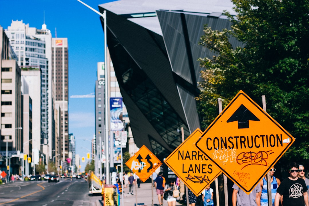 Construction site with "Now Hiring" sign - Greater Boston contractors