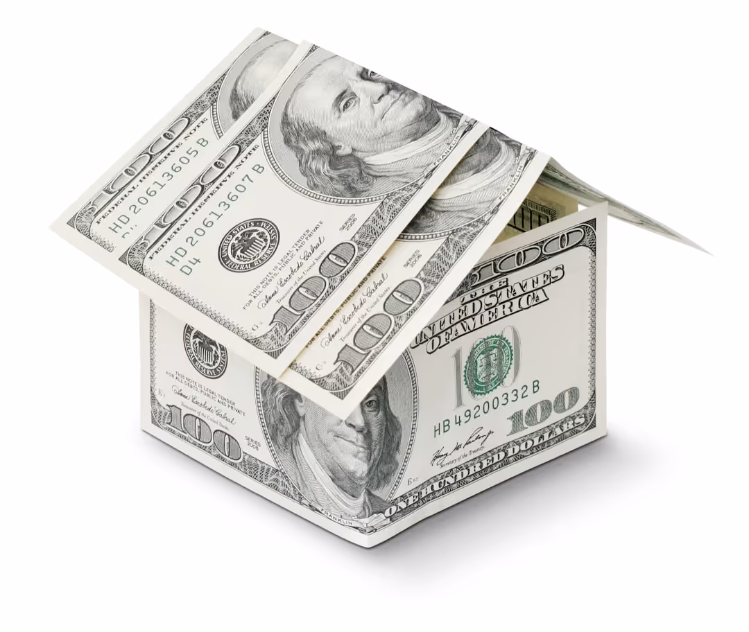 miniature home made of hundred dollar bills - homeowners insurance definition