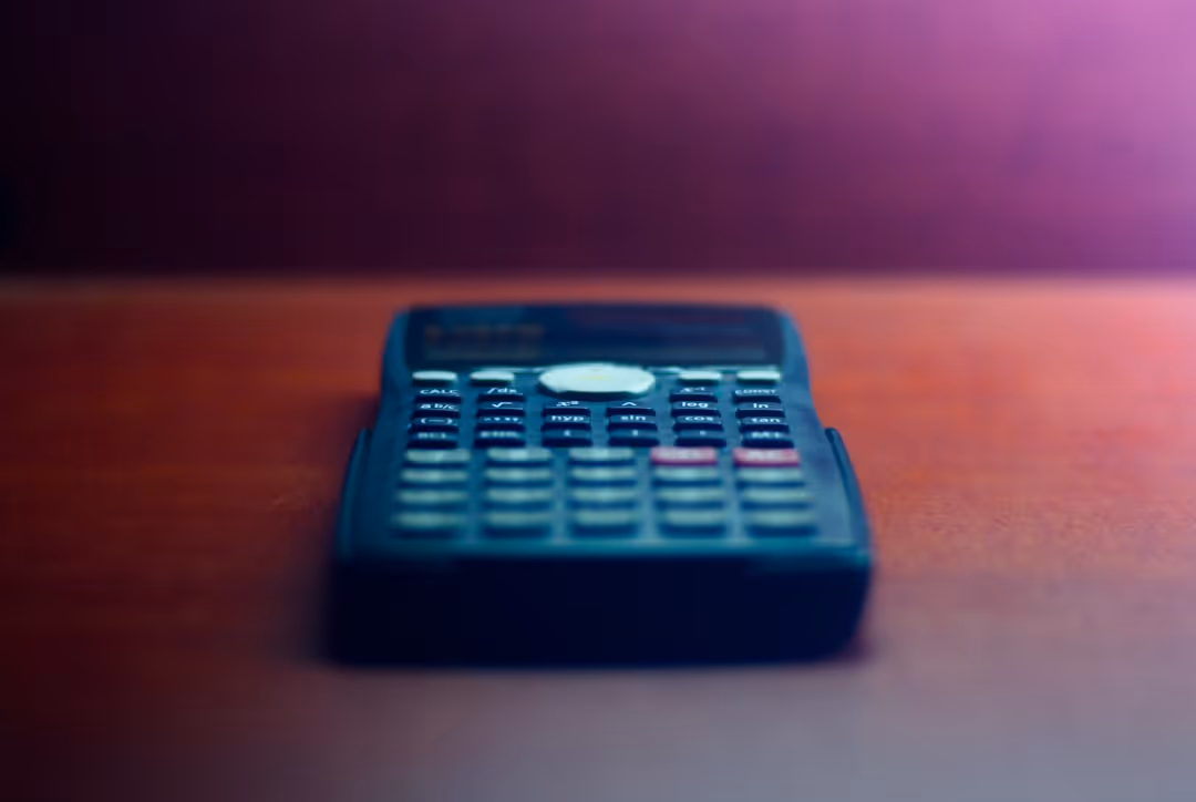 Calculator or piggy bank representing costs and savings - workers comp for independent contractors