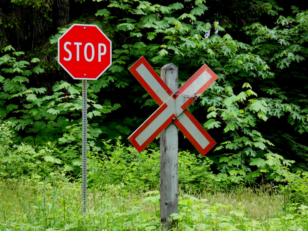 STOP sign with text overlay of common exclusions - railroad contractor insurance