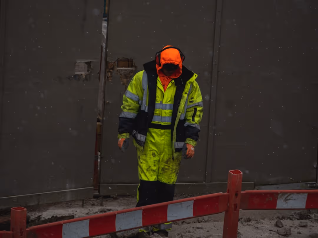 contractor wearing proper safety gear on a job site in Brookline, MA - Workers comp for contractors contractor wearing proper safety gear on a job site in Brookline, MA - Workers comp for contractors