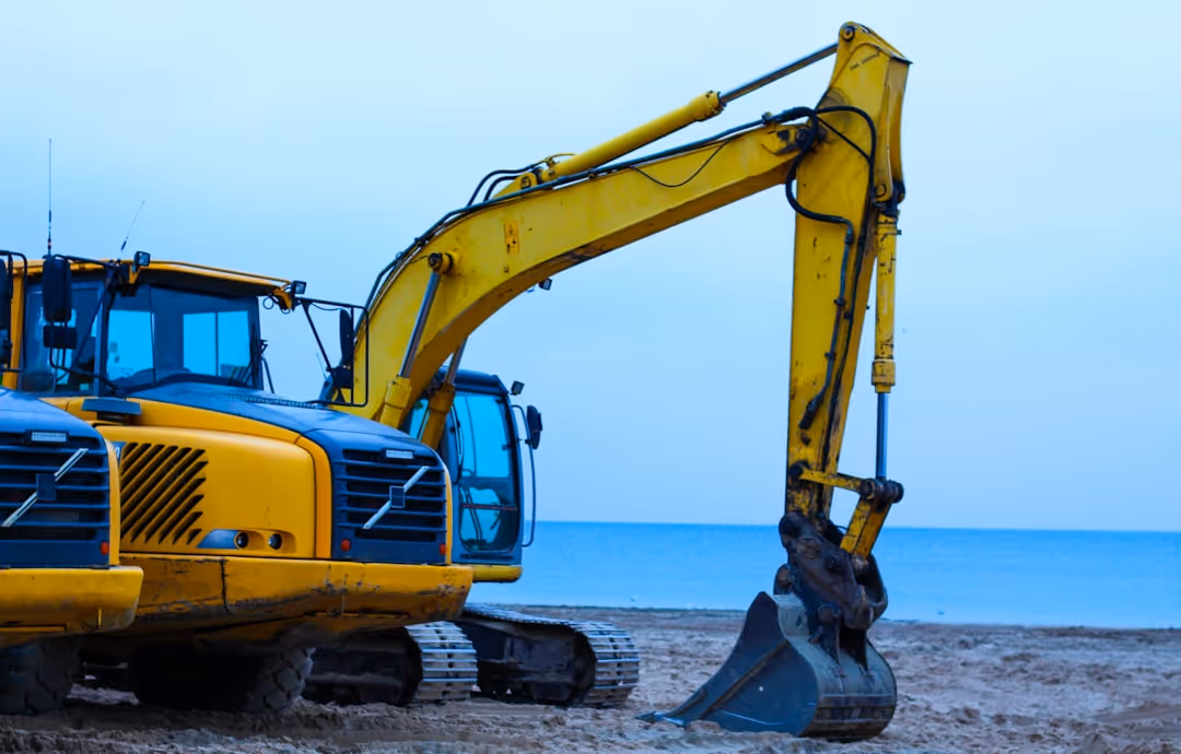 large backhoe on the beach