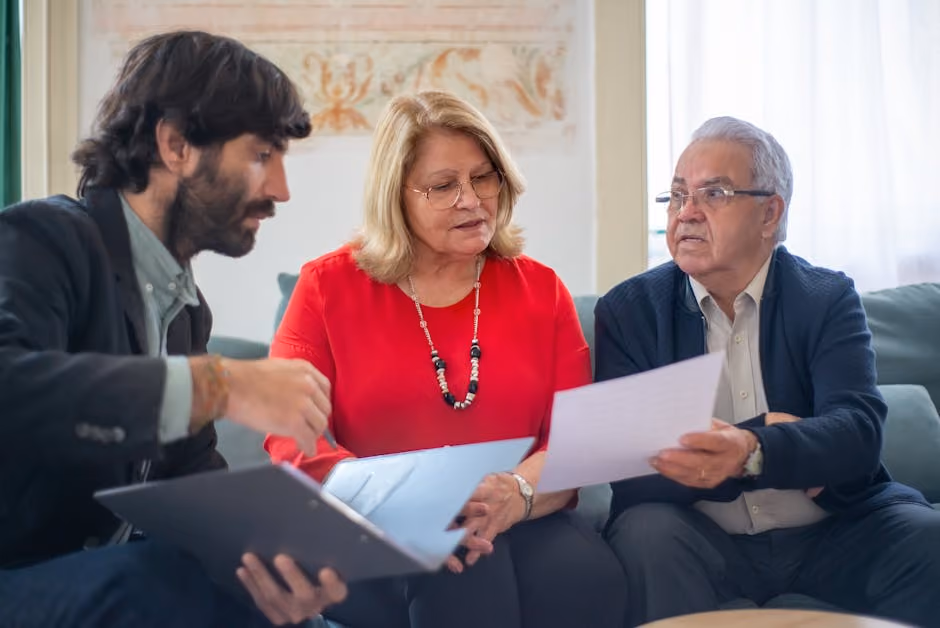 Image of an insurance agent consulting with a couple in their home - HO3 home insurance Image of an insurance agent consulting with a couple in their home - HO3 home insurance