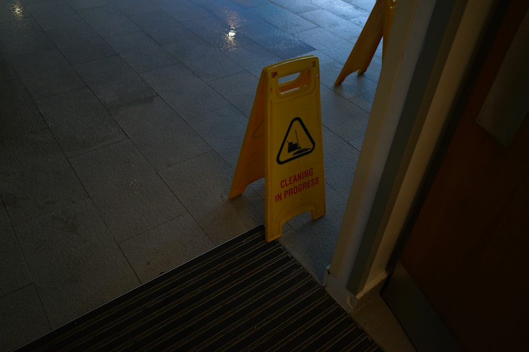 slip and fall caution sign in a retail setting - business owners insurance near me