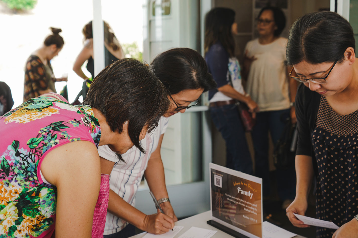 Women signing up on sheet